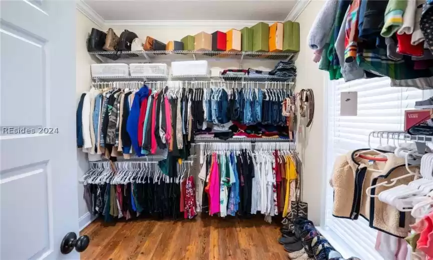 Spacious closet with pass-through to the bathroom and laundry room