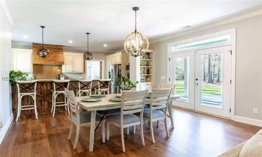 Open floorplan with french doors leading to back deck.