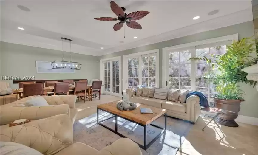Living room with ceiling fan & crown molding