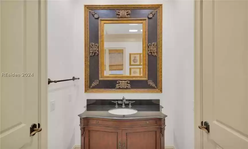 Full Bathroom with granite top vanity and crown molding