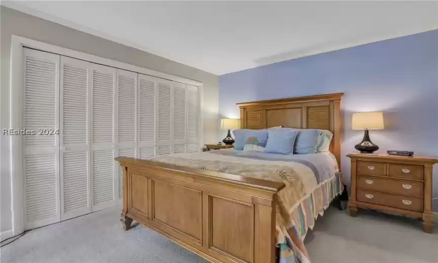 Large bedroom with door leading to outside patio