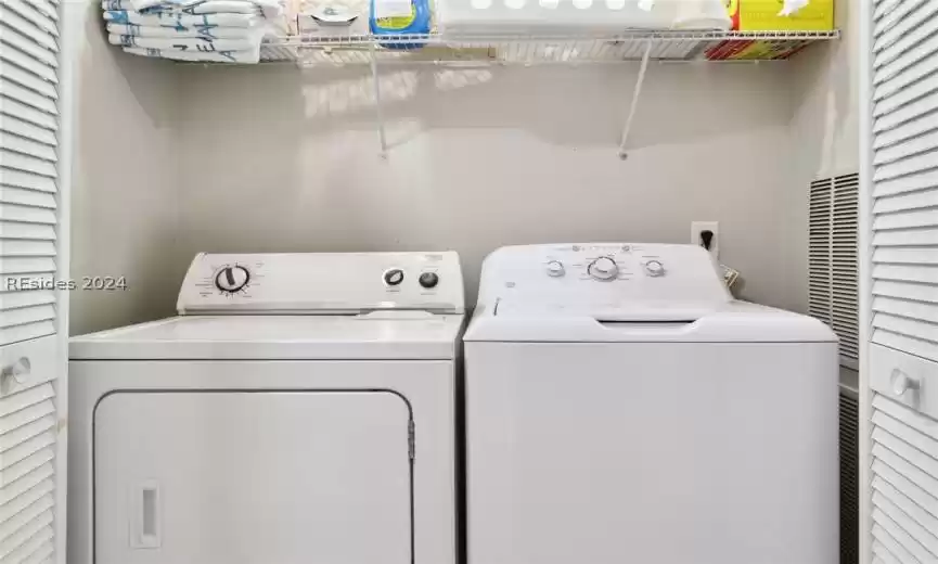 Washer and dryer in the hallway.