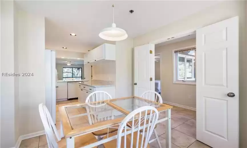 Dining area and kitchen directly off of the entryway.