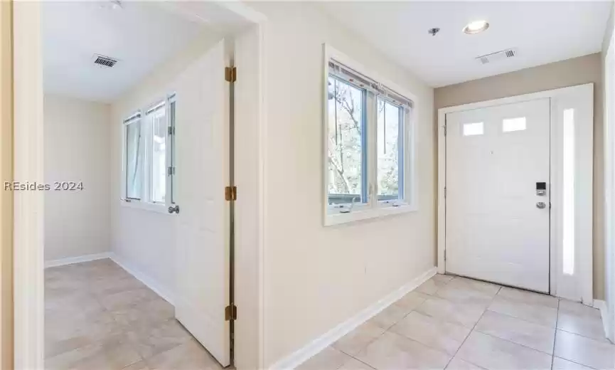 Tile flooring throughout this main level including the bedroom on the main level. Newer windows on this level also.