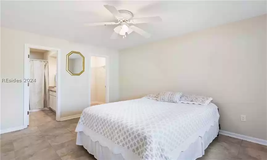 Spacious main level bedroom with walk-in closet and ensuite.