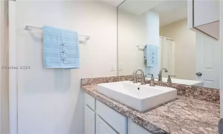 Raised vessel sinks throughout villa, with laminate countertops.