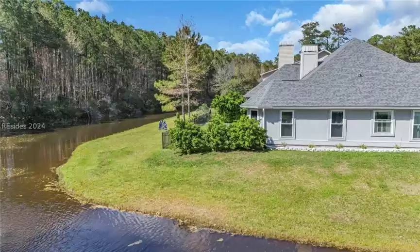 Wonderful home site with wrap-around lagoon and deep wooded setting just beyond. Updated and Upgraded home is perfectly situated for enjoying beautiful views ... really does feel like being on an island.