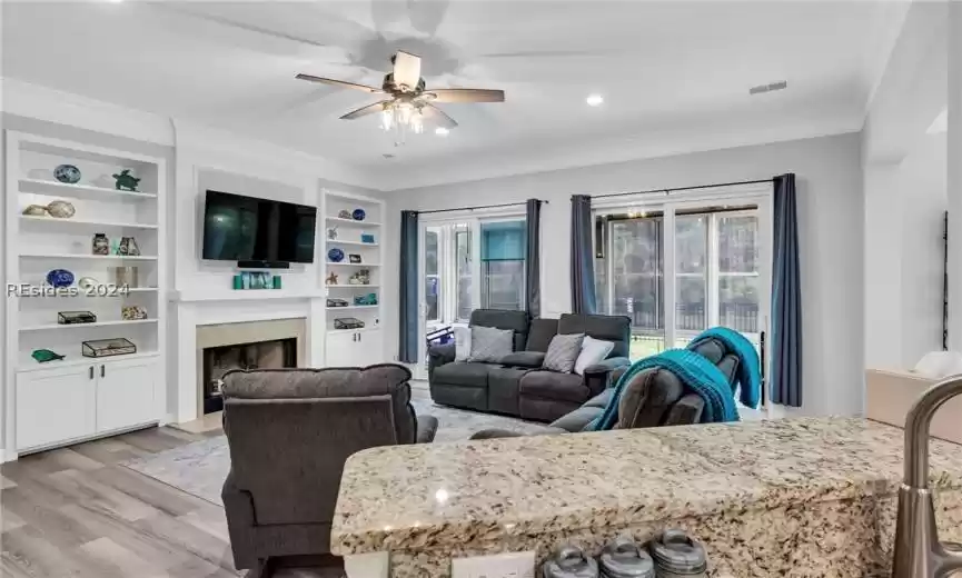 Bedroom number two with two large windows, ceiling fans with light and neutral carpet with premium padding. (Carpet installed in 2021).