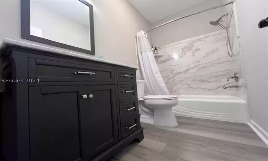 Spacious master bedroom closet with custom shelving.