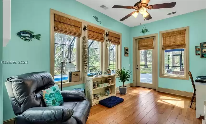 A very comfortable and convenient sun room with large windows and walk-out to the pool ... a very special room to relax, rest, read. (One of the owner's favorite retreats).