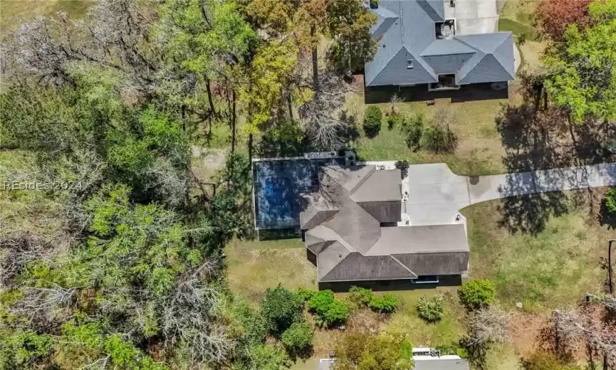 And even higher to showcase the wooded area in the rear and around this home and the privacy surrounding the pool.