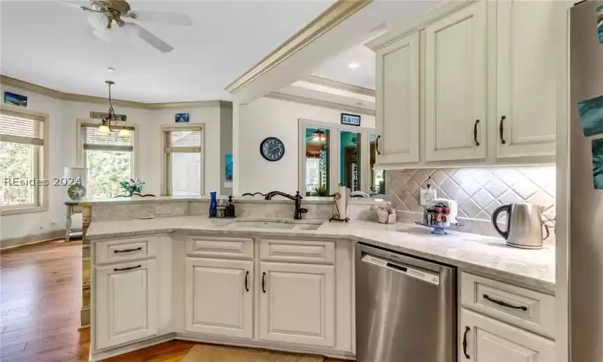 One more look at this open layout kitchen that features stainless steel appliances.
