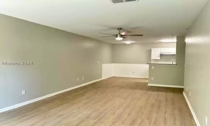 Spare room with light hardwood / wood-style floors and ceiling fan