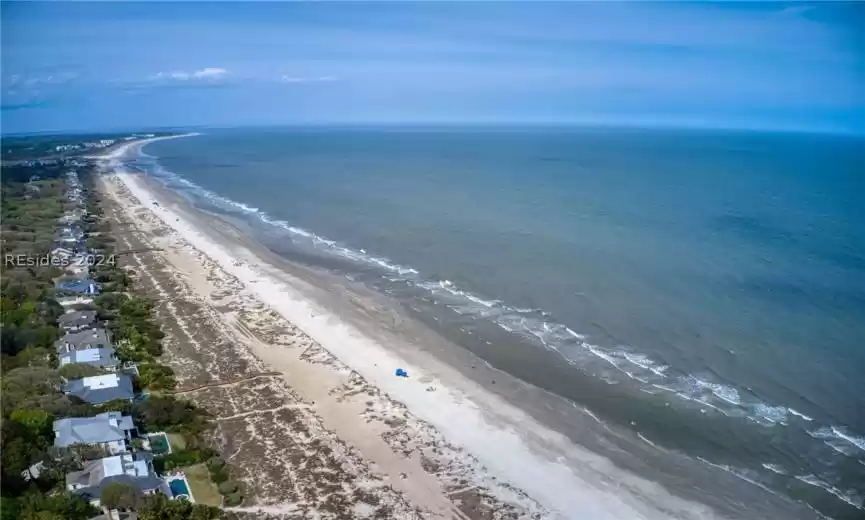 Aerial view with a water view and a view of the beach