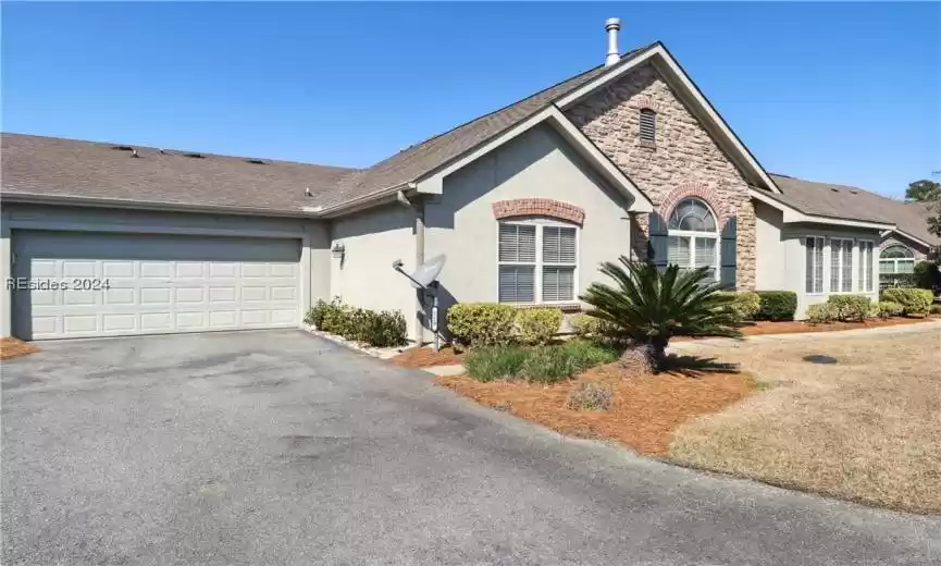 View of front of property with a garage