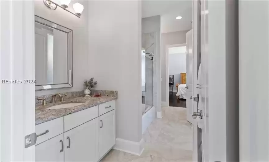 Bathroom with tile flooring and vanity