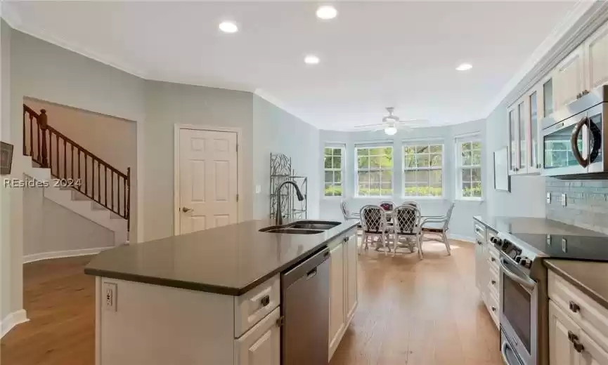 View of kitchen island and eat in dining area