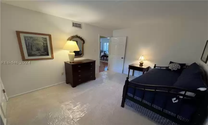 Bedroom featuring light hardwood / wood-style floors and ceiling fan