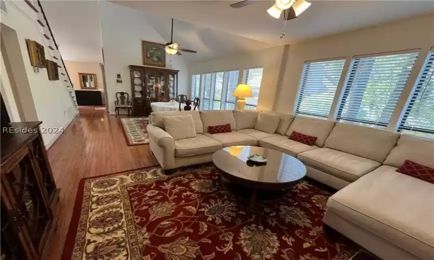 Bedroom featuring light hardwood / wood-style flooring and lofted ceiling