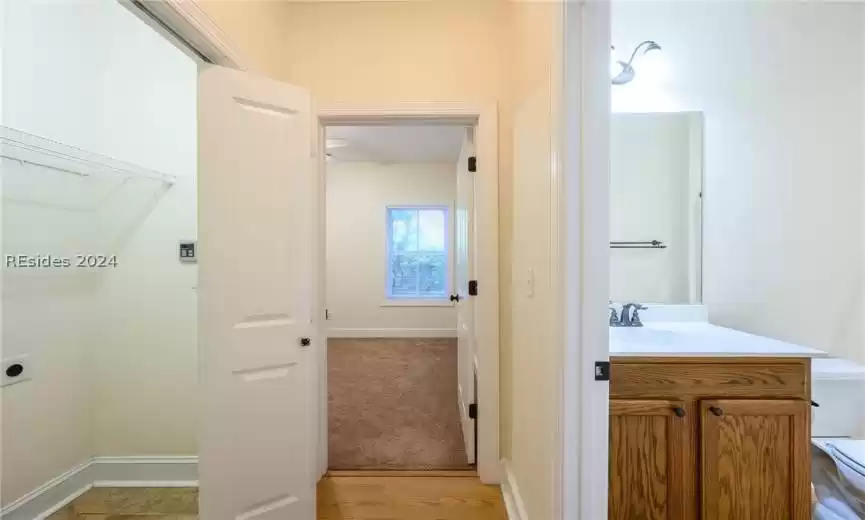 Bathroom featuring oversized vanity and hardwood / wood-style flooring