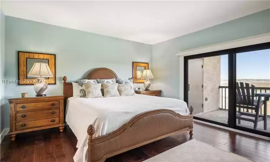 Immaculate primary bedroom with coastal furnishings.