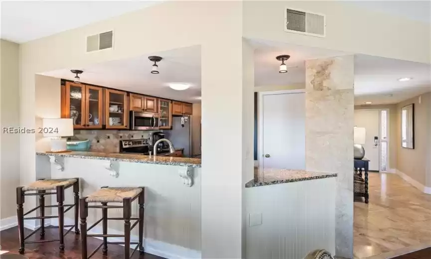 Eat-in kitchen with gorgeous granite countertops.