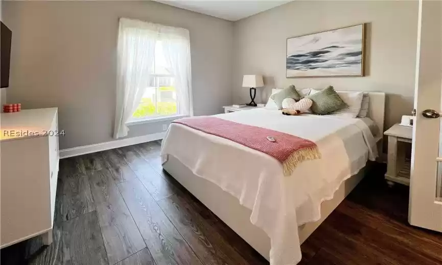 Bathroom with a shower with door and tile floors