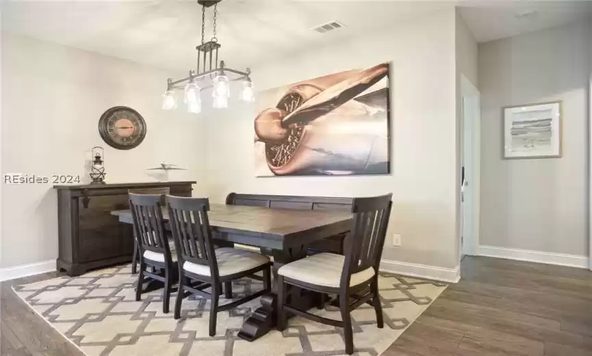 Dining area featuring dark hardwood / wood-style flooring