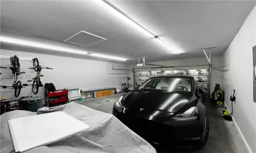 Garage featuring a garage door opener