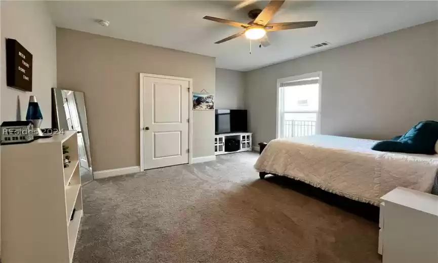 Living room featuring light hardwood / wood-style flooring and ceiling fan