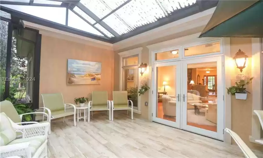 Screened covered porch featuring 8