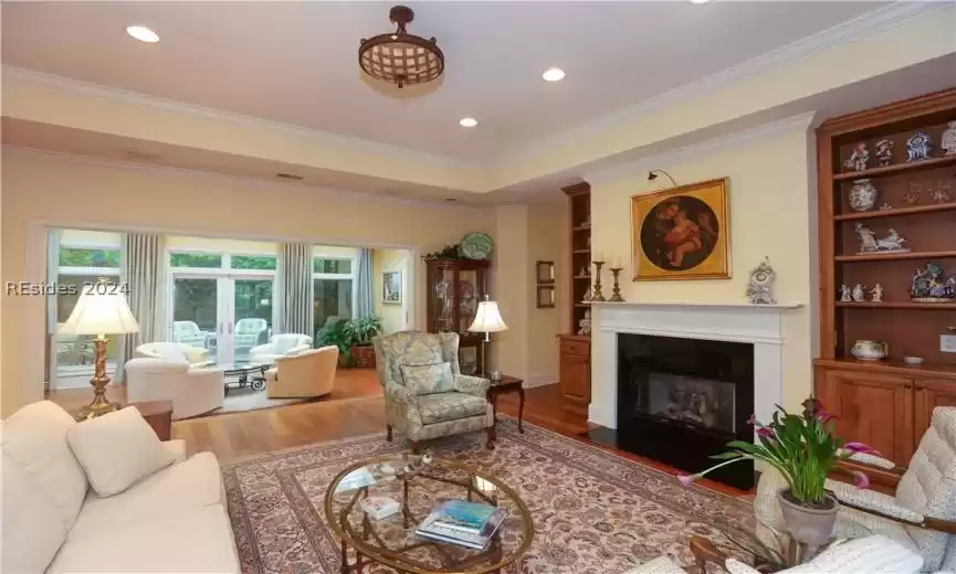 Living room with ornamental molding and 5
