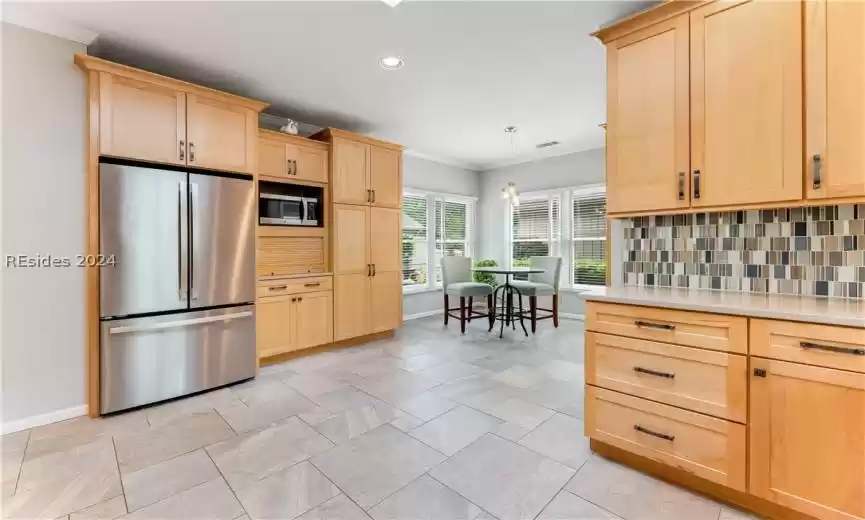 Pantry to the right of the table is great for brooms, etc