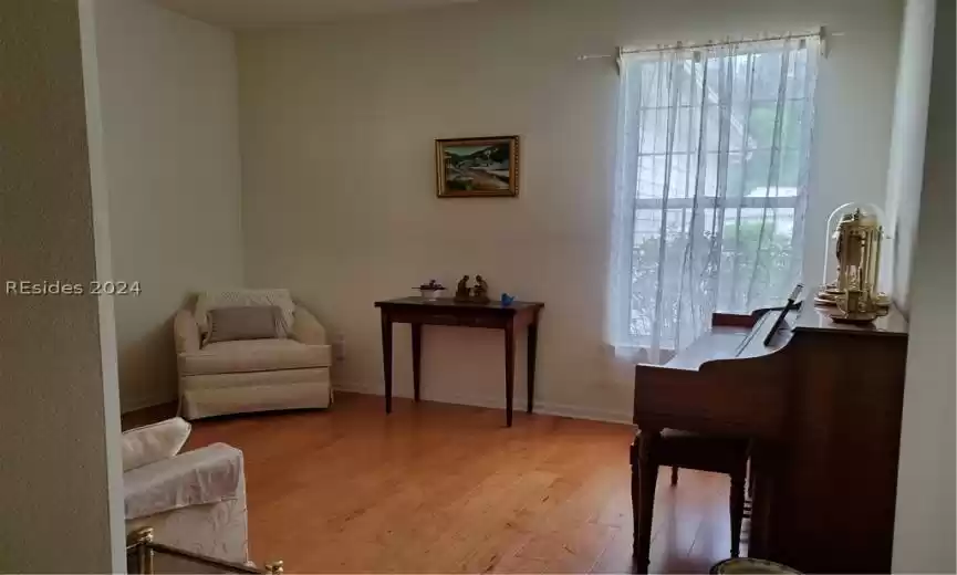 The master bath is large with double vanity and a separate toilet/water closet.  There is a transom window that lets in natural light.