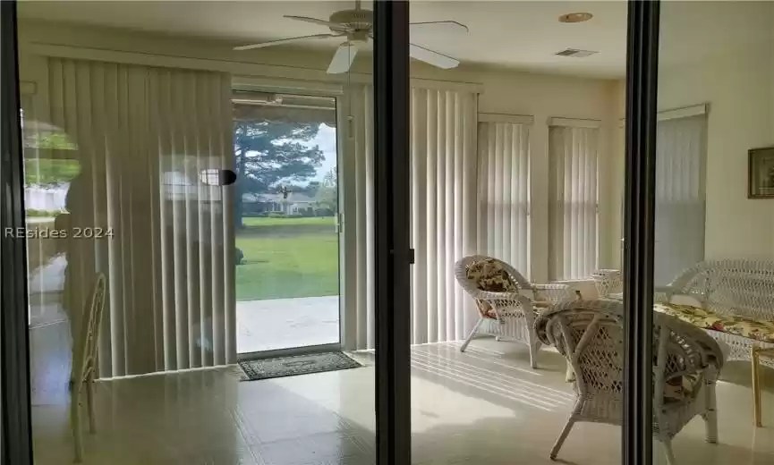 This covered front porch has a nice side walk and a courtyard area for gardening! It's a nice place to sit and enjoy the beautiful subtropical plants and climate year round.