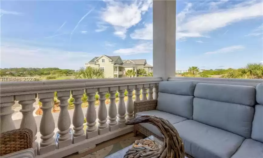 Take in the breathtaking views, and relax on the living room balcony. Marsh, distant golf, and ocean views all for your viewing enjoymant.