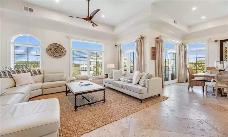 Open and luxurious living room / great room with breathtaking views through French doors in the dining room.