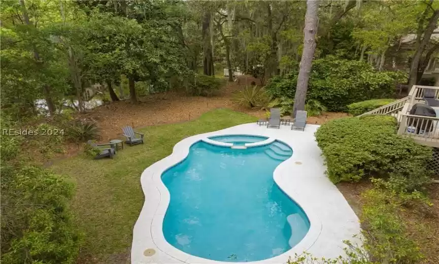 Perfect backyard with pool, grass and lagoon views.