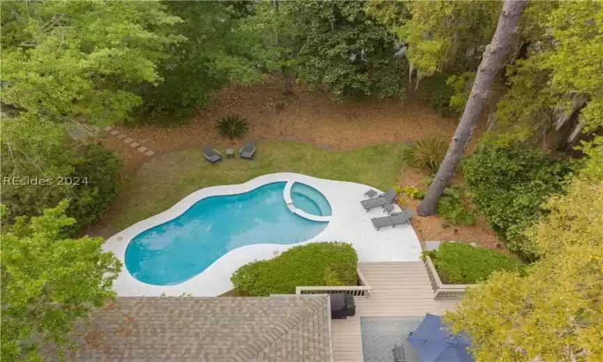 Looking down at the pool and beautiful backyard.