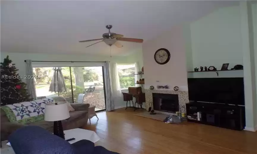 Living room with fireplace and smooth cathedral ceiling