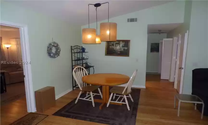 Living room with fireplace and smooth cathedral ceiling