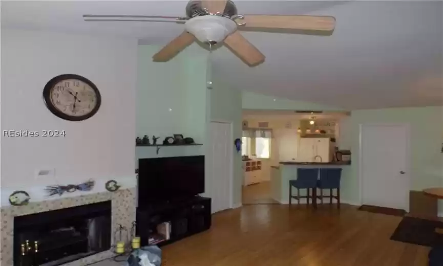 Living room with fireplace and Brushed nickel ceiling fan