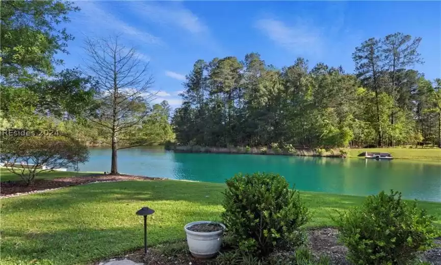 Back of Clubhouse featuring a Lake view