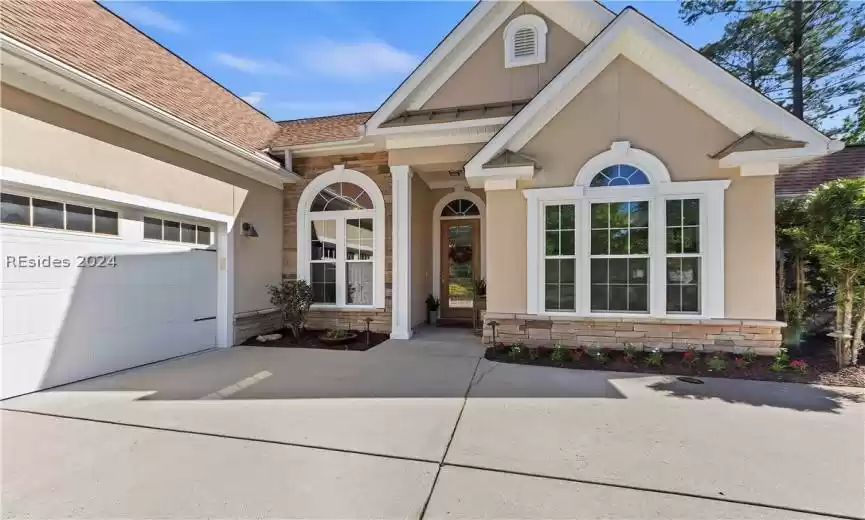 View of front of property with a front yard