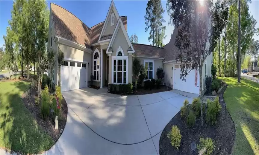 View of front of property with TWO 2-car garages on this Double Lot.