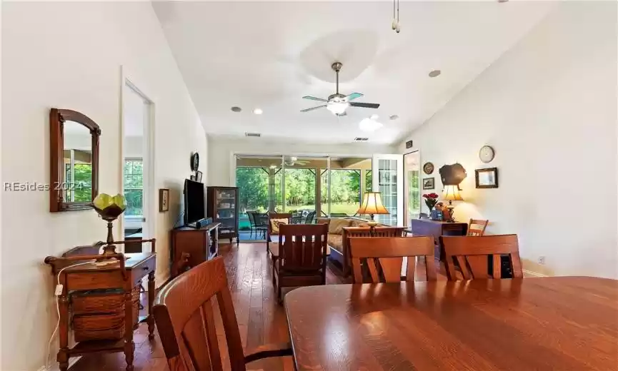 Dining space featuring dark hardwood / wood-style floors and ceiling fan