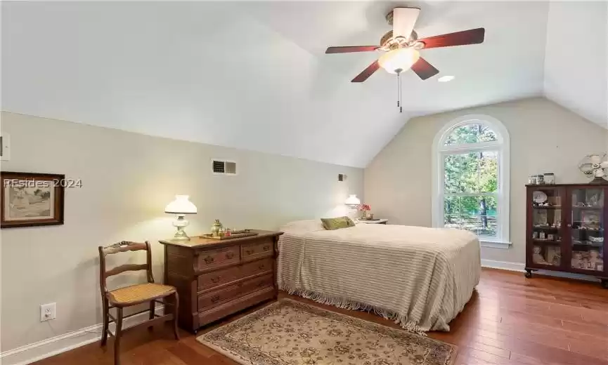 Upstairs Bonus Bedroom #4 with ceiling fan, vaulted ceiling, and hardwood flooring