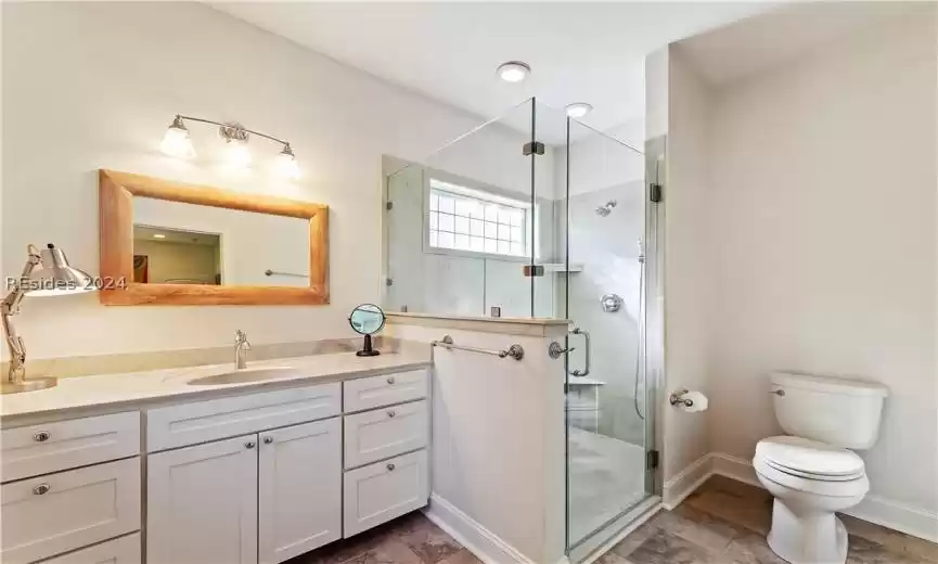 SECOND Primary Bathroom with walk-in shower, toilet, oversized vanity, and tile flooring