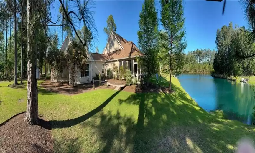 View of yard with a water view