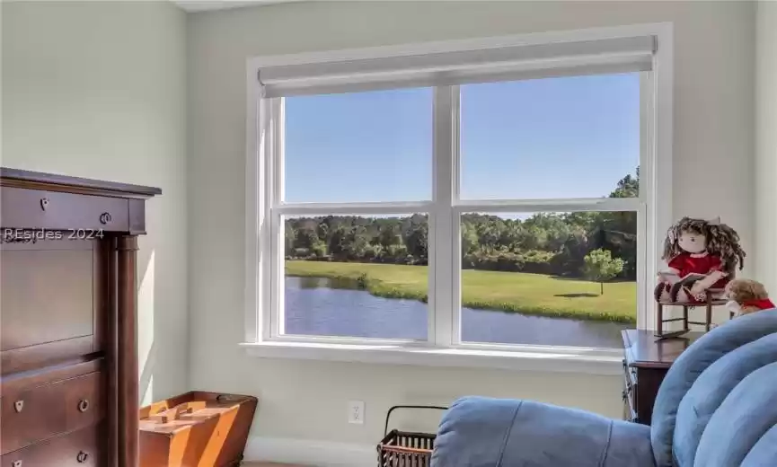 Sitting room with a water view and a wealth of natural light